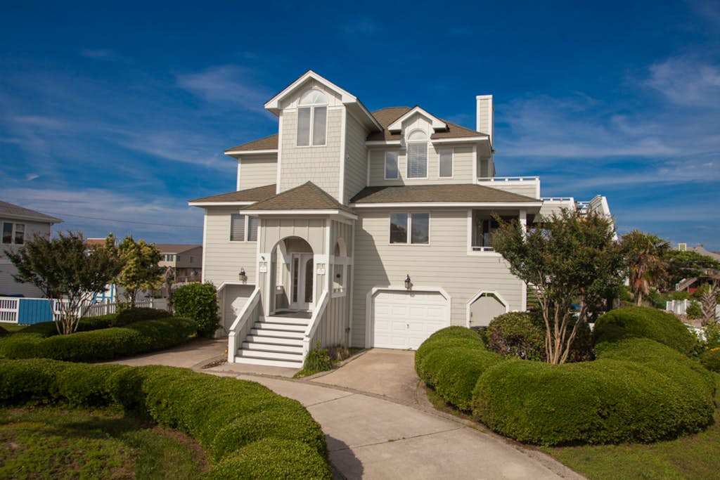 Revival-style canalfront home with private pool, two docks, beach access & views