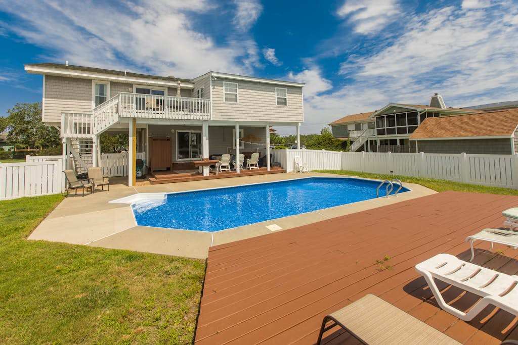 Canal-front home with private pool, hot tub, fishing dock, walk to the beach,2 dogs