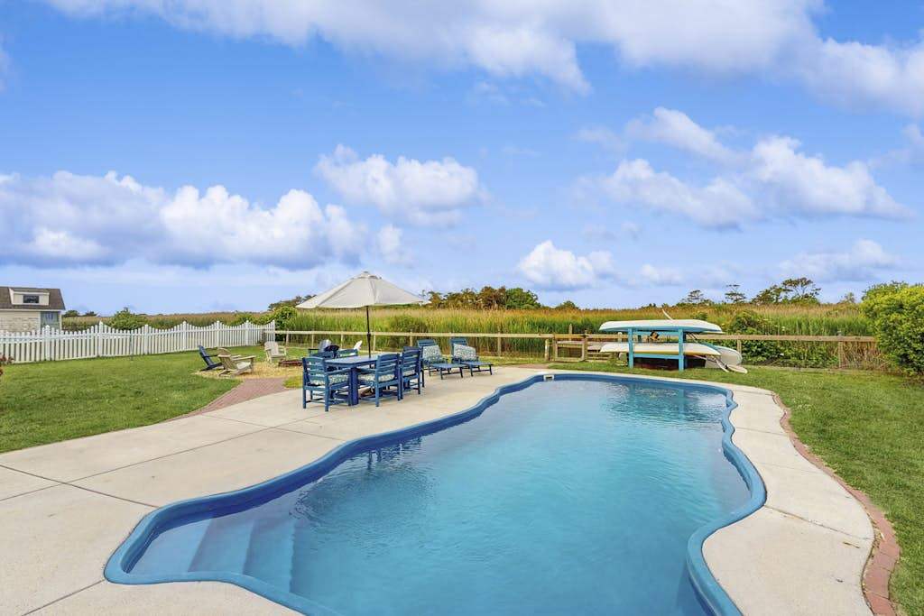 Bayfront home with great views, pool, hot tub, deck, sunroom, & dock - dogs OK
