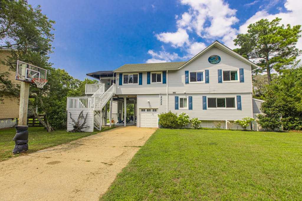Lakefront home with water access, canoes & screened porch - walk to the beach