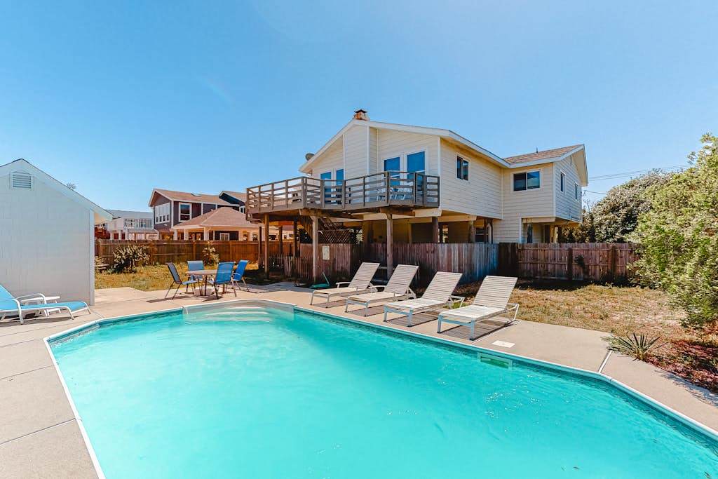 Dog-friendly home with private pool, fenced yard, ocean view, nice deck & WiFi