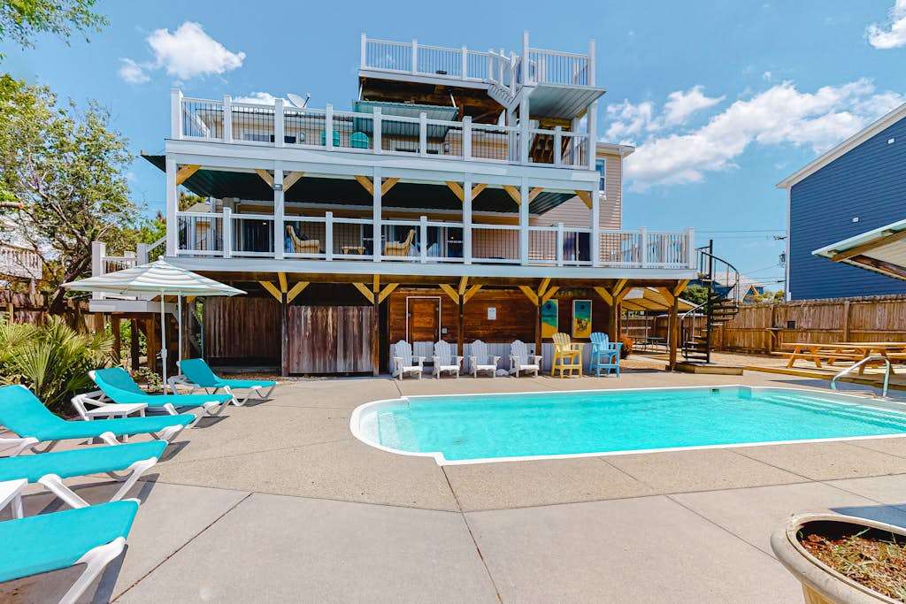 Renovated canal home with private pool, dock, roof deck, ocean & bay view, wet bar