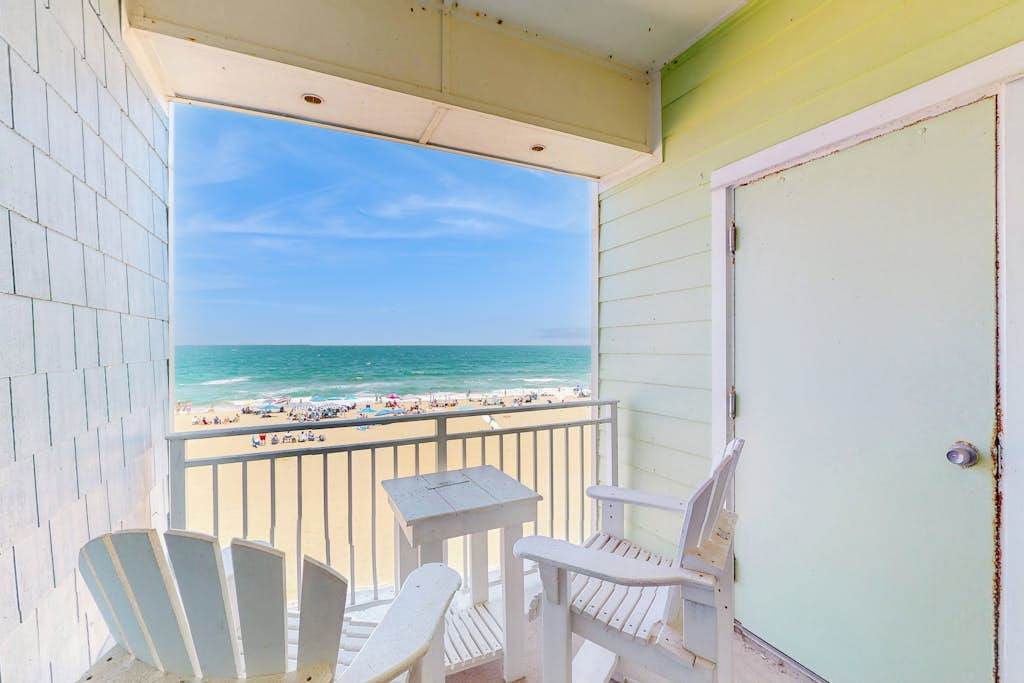 Luxury oceanfront condo on the beach with balcony & pools