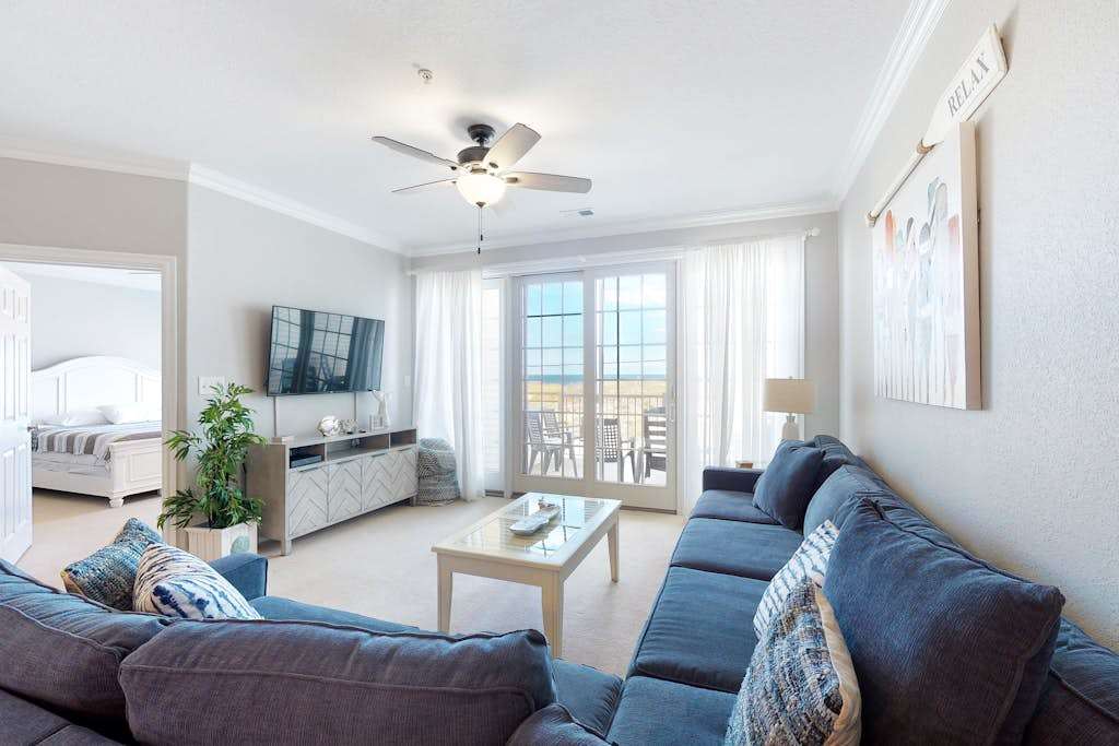 Oceanfront condo with incredible beach views, shared outdoor pool, gym, & AC