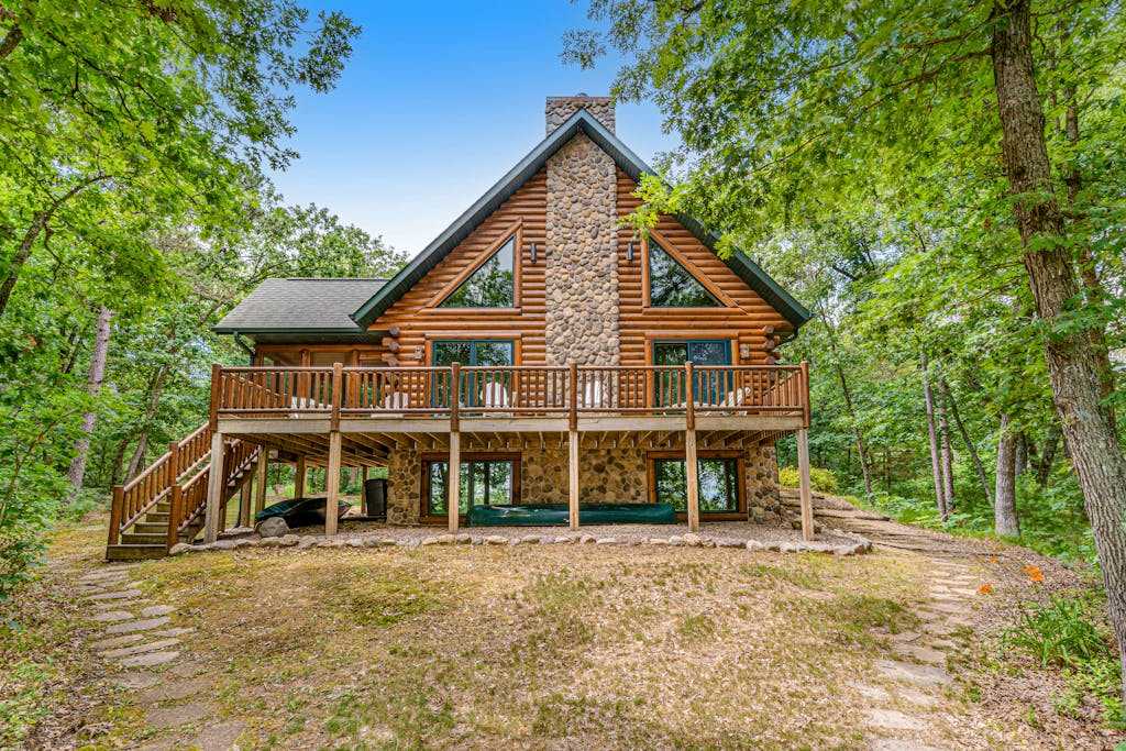Riverfront cabin with a dock, kayaks and a canoe - firepit and water views