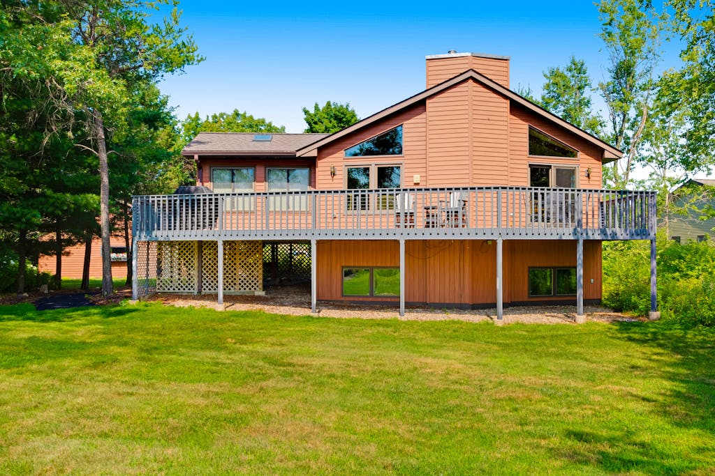 Golf course-front home with 2 pools, private beach, boat launches, tennis, grill
