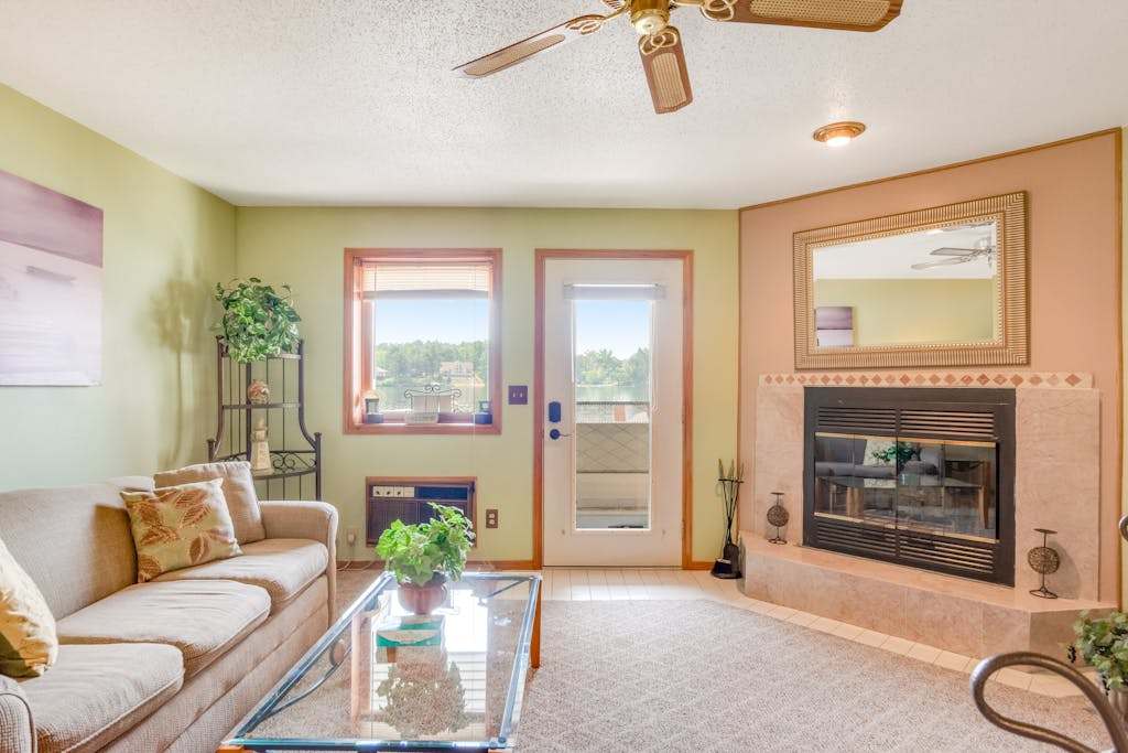 Waterfront condo with resort amenities, grill, firepit, jetted tub, & partial AC