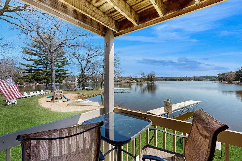 Inviting lakefront condo - amazing views, beach access, fireplace, dock, AC, washer & dryer