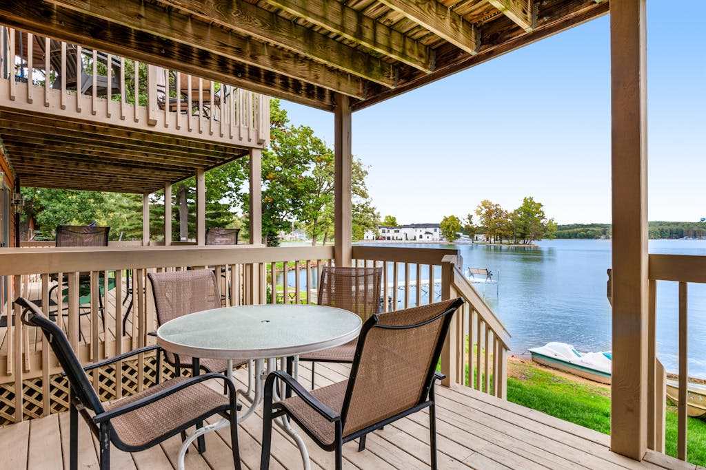 Inviting lakefront retreat - amazing views, beach access, dock & inviting deck