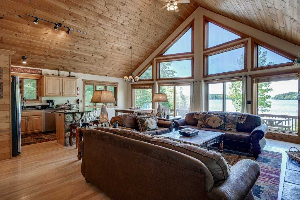 Lakefront lodge with private dock, firepit, deck & sunset views