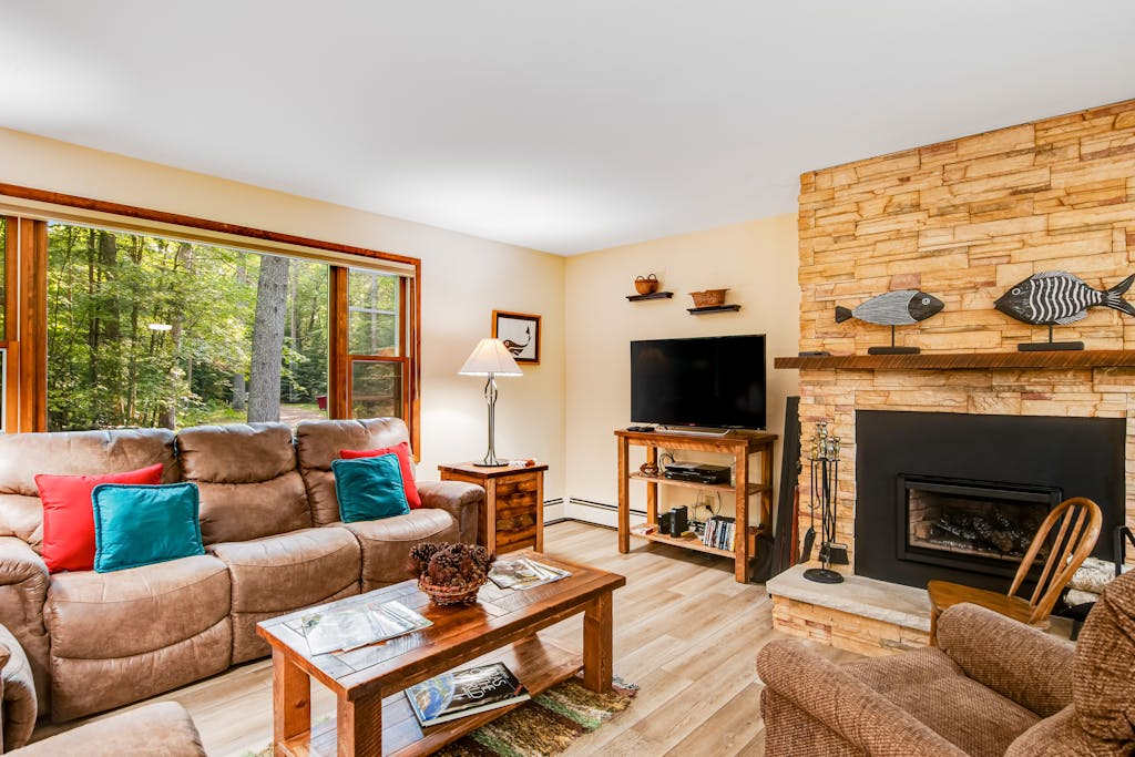 Charming riverfront home with a fireplace, dock, washer & dryer - close to town