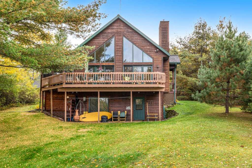 Tranquil lakefront oasis with private dock, canoe, kayak, & three living areas