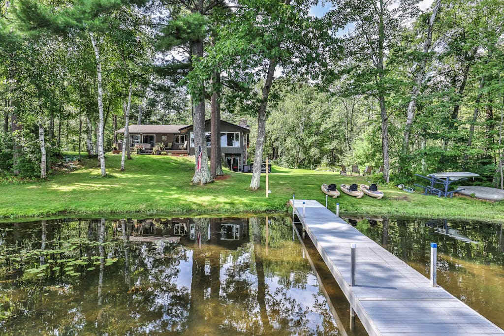 Private waterfront home with dock, kayaks, firepit, & open layout - dog-friendly
