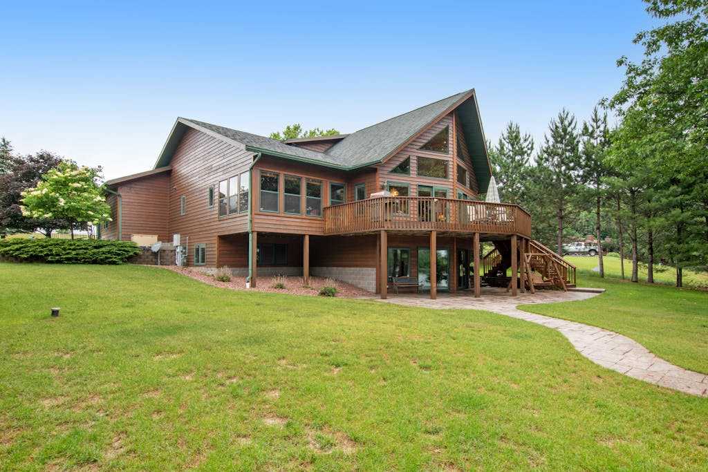 Dog-friendly lakefront getaway with dock, firepit, wet bar, game room, & AC