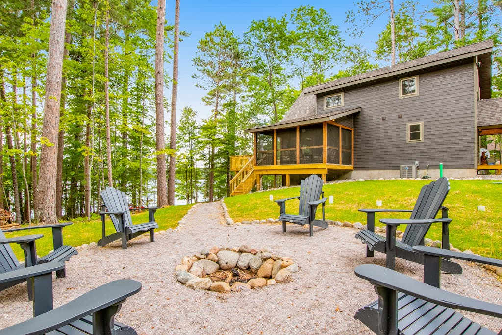 Gorgeous lake home with private pier, beach, firepit, deck, & grill and water toys