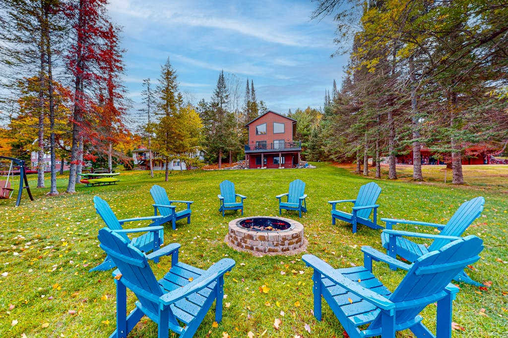 Lakefront home with yard, private dock, deck, firepit, & washer & dryer