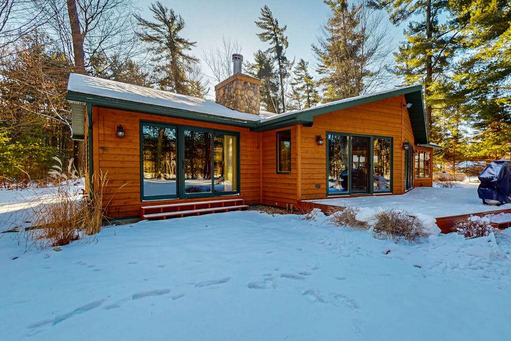 Charming Waterfront Home with Dock, Fire pit, WIFI, near Town & Trails
