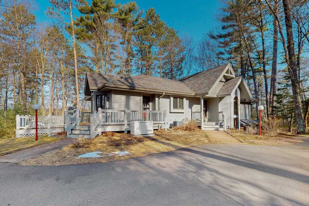 Lakefront home with private outdoor sauna, dock, firepit, wood fireplace & patio