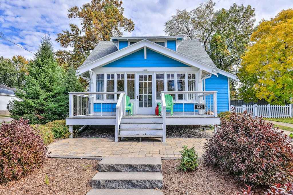 Charming lakefront home with shared dock, porch, & sunroom - walk downtown