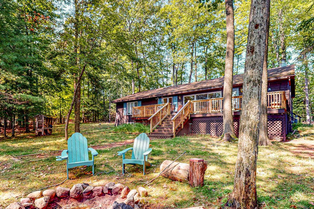 Lakefront, dog-friendly home with canoe, firepit, large deck, & washer & dryer