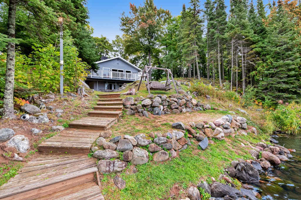 Spacious lakefront home with pier views, canoe, and fire pit - family-friendly
