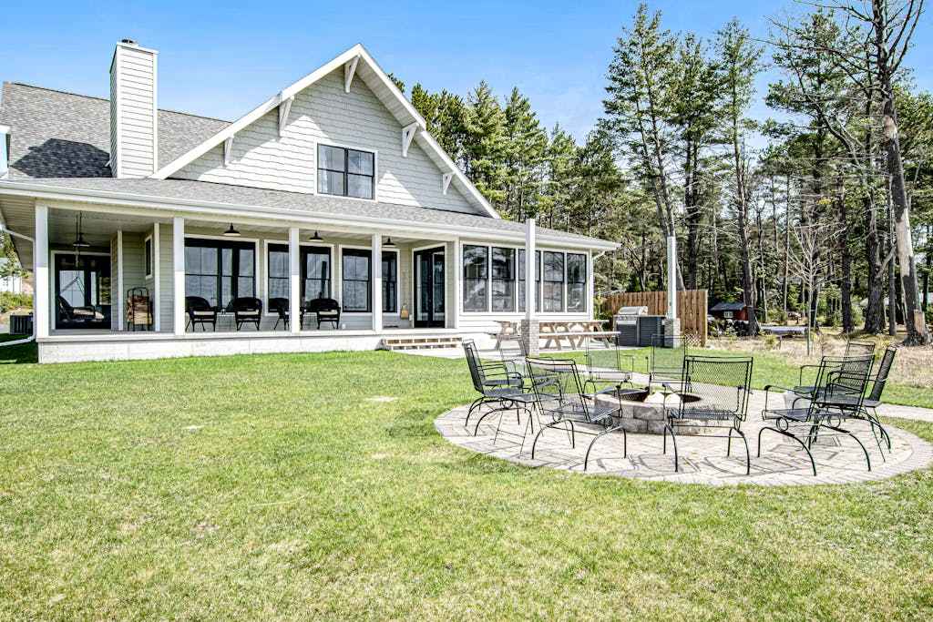 Dog-friendly, lakefront house with beach access, dock, AC, washer & dryer, patio, & firepit