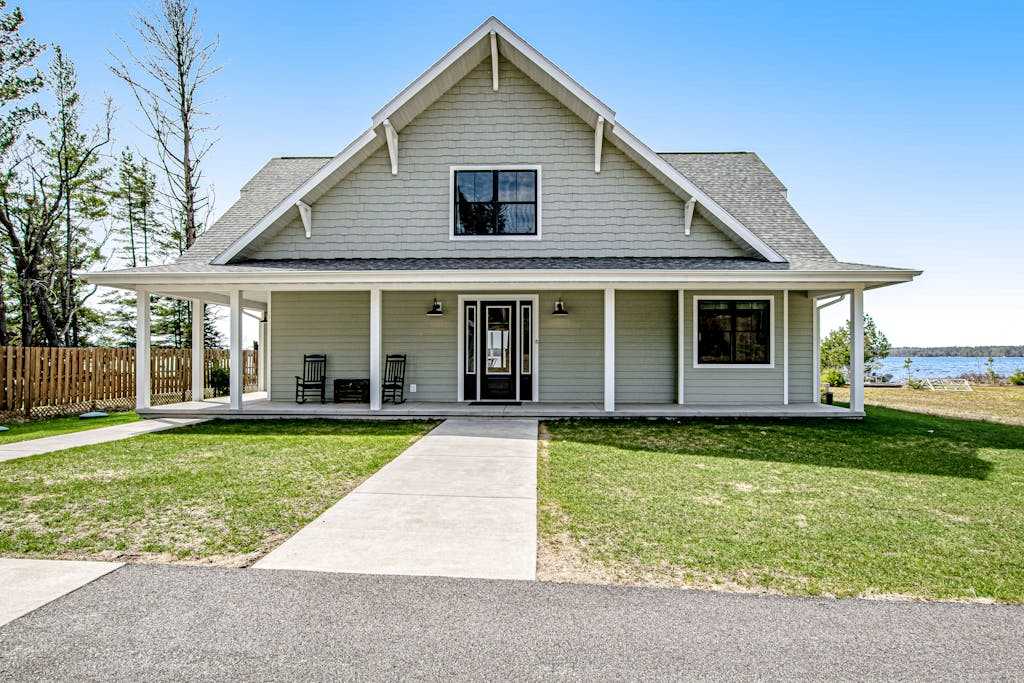 Two dog-friendly lakefront homes with docks, kayaks, rowboat, firepits & beach