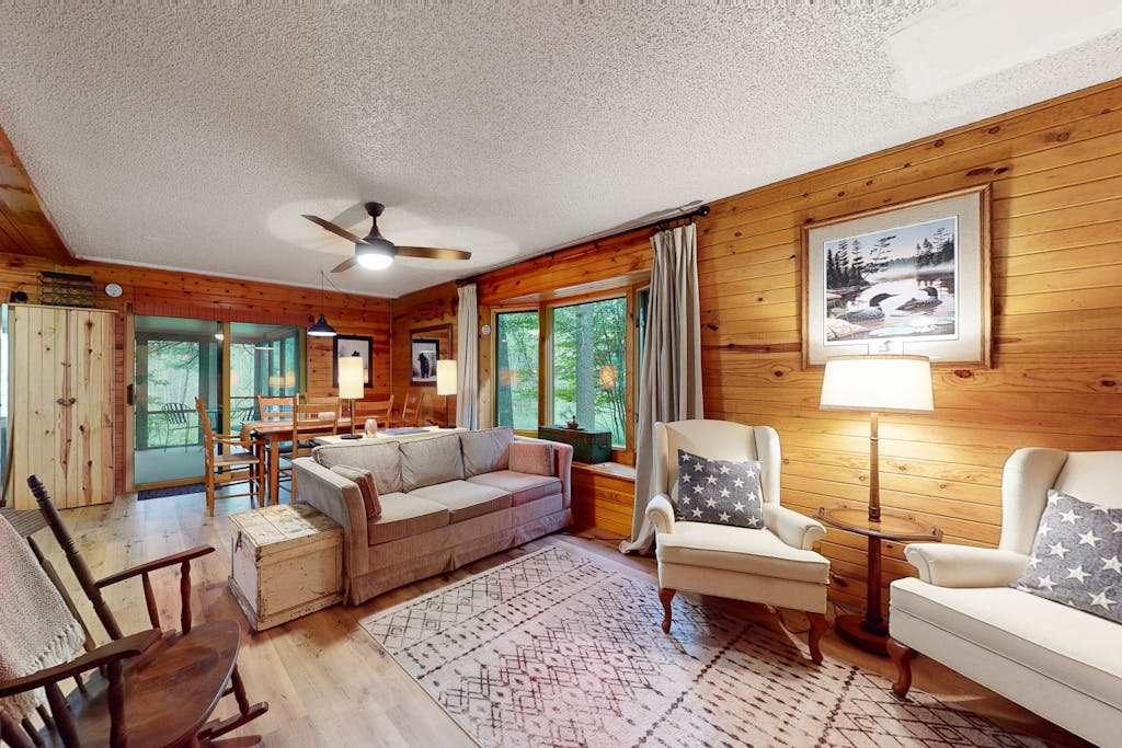Lakefront cabin with kayaks, firepit, dock & spacious interior