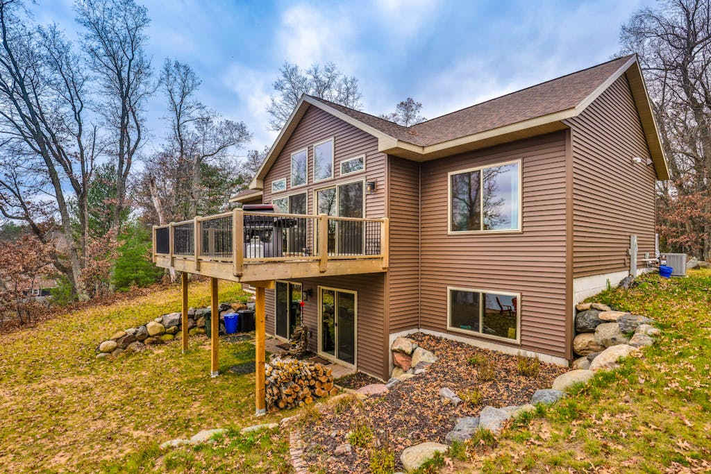 Recreational lakefront home with private dock, trails access, & washer & dryer