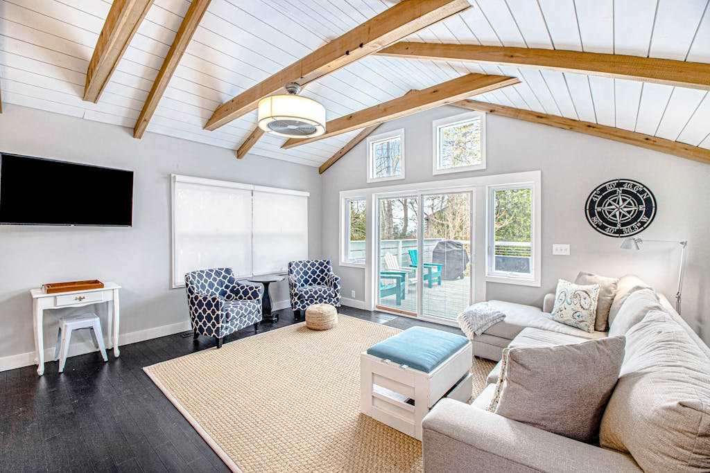 Fully-renovated lakefront home with beach cabana, association beach, & firepit