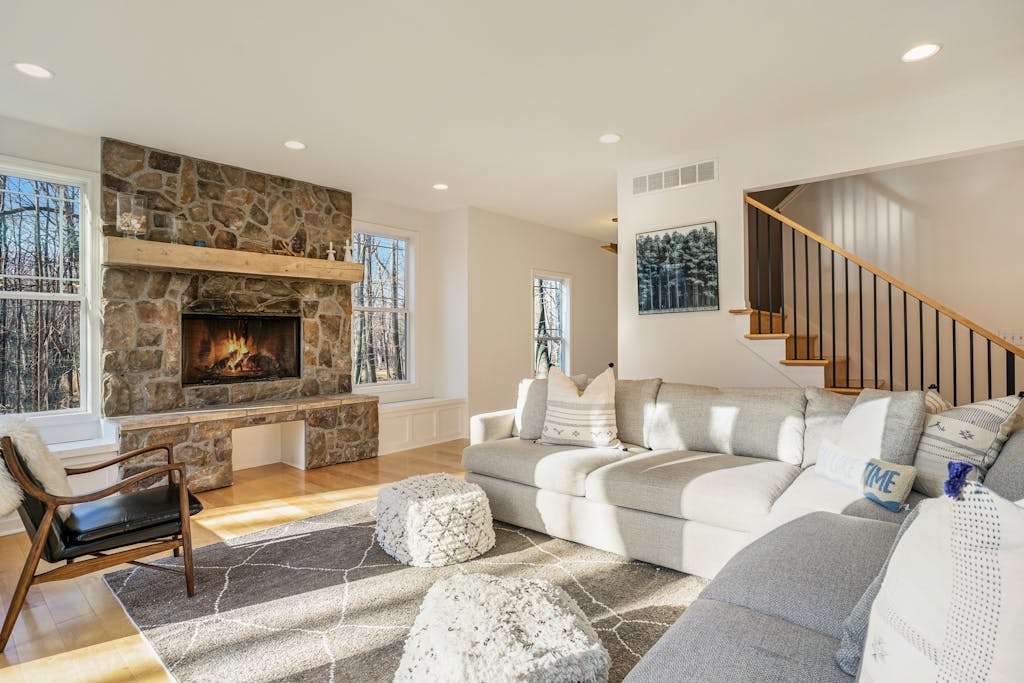 Modern Lake Michigan home with wood fireplace, open layout, deck, washer & dryer, & AC