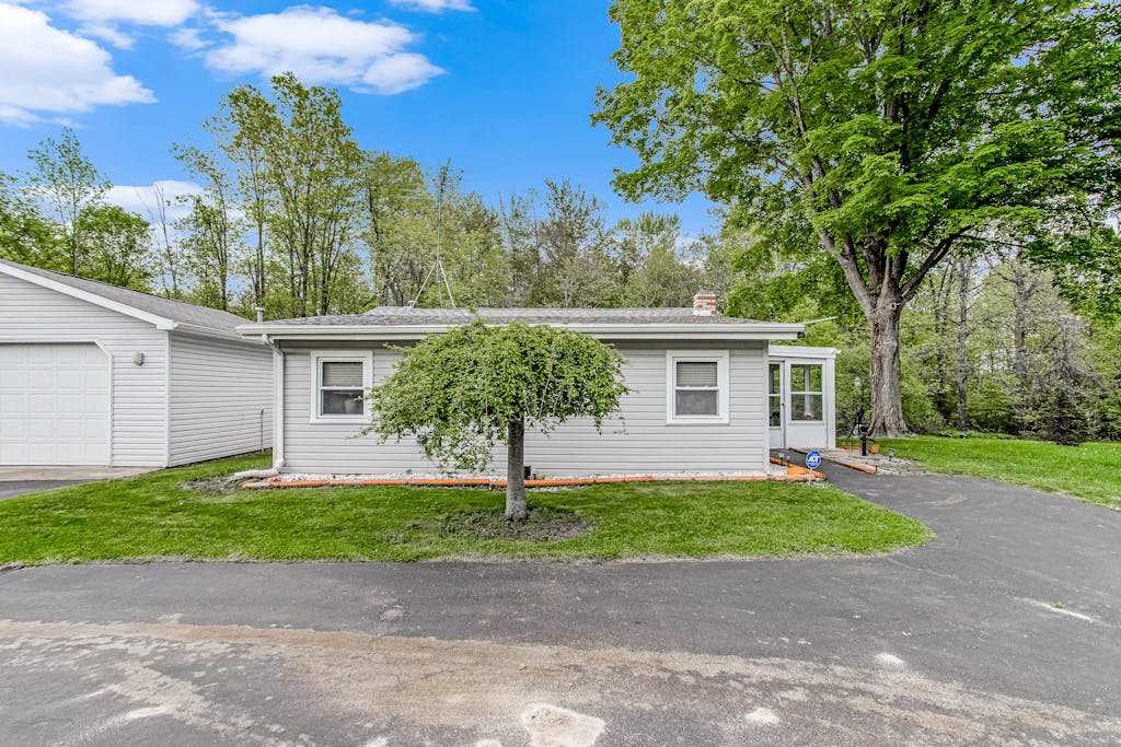 Charming home with sunroom, large yard, full kitchen, & washer & dryer