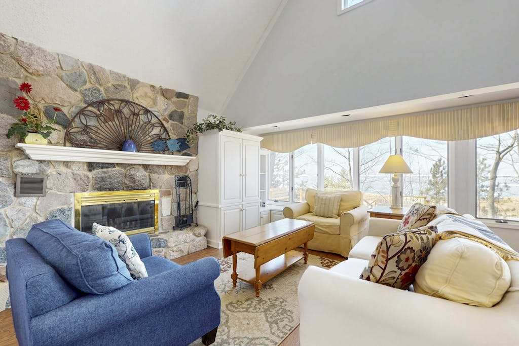 Spacious lakefront home with panoramic views and private beach