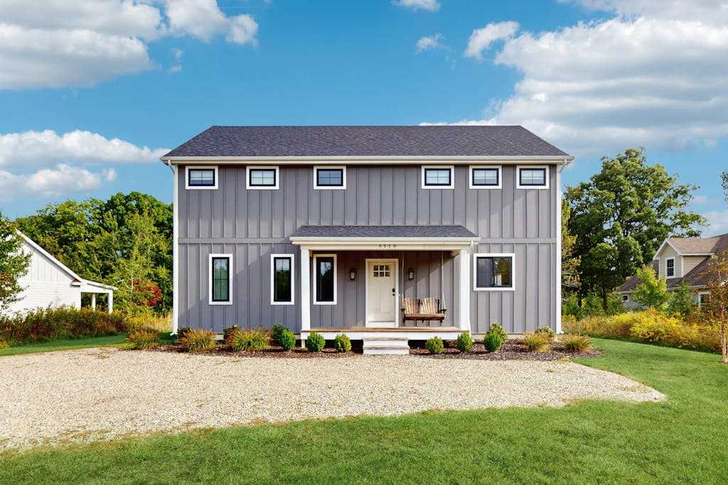 Newly-built home on a grassy lot with washer & dryer & screened deck