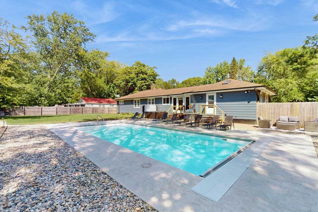 Lovely home with hot tub, pool, two kitchens, enclosed backyard, firepit & grill