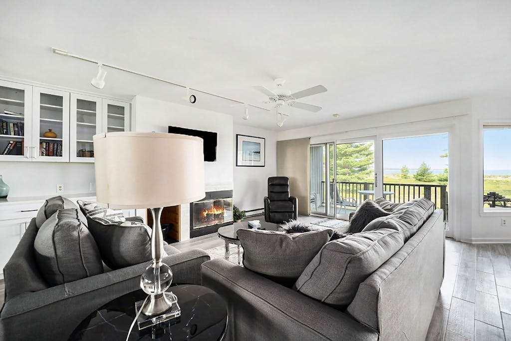 Lower-level beachfront condo with deck, lake views, washer & dryer, fireplace