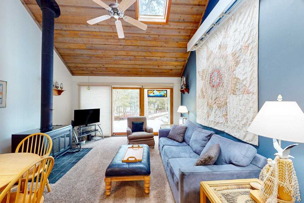 River-view condo with fireplace, deck, washer & dryer, and community firepit