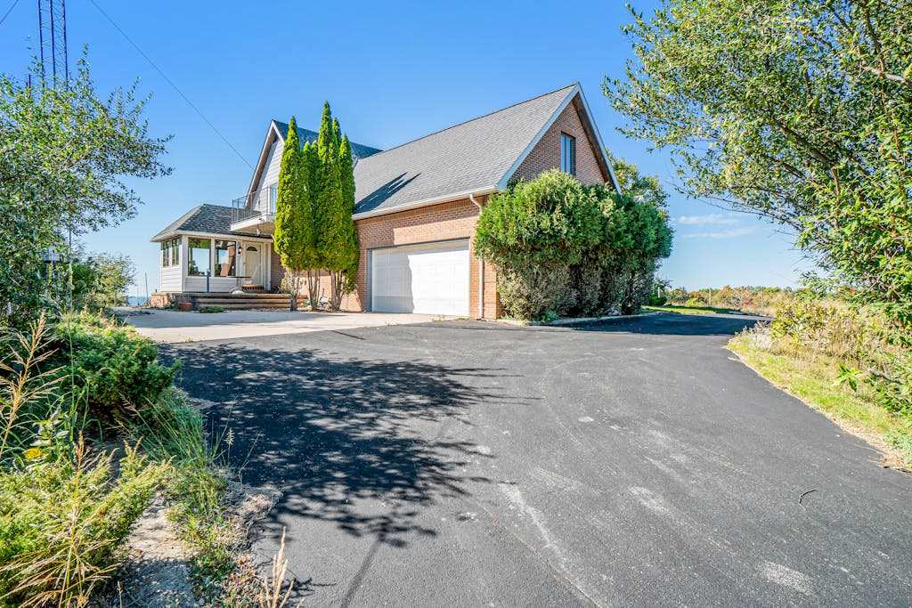 Dog-friendly, lake view home with three season room, fireplace, video projector