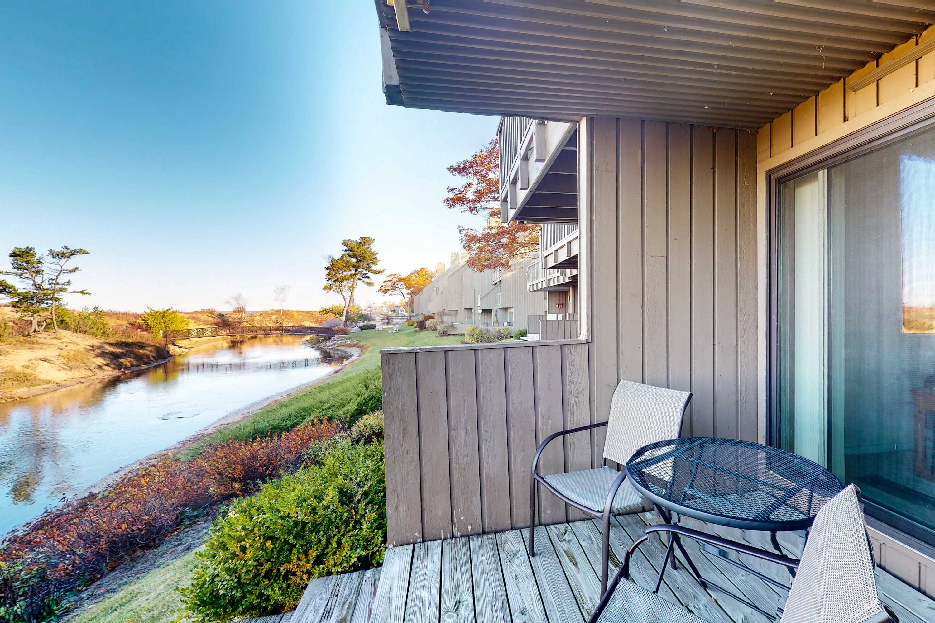Riverfront condo with beach access to lake, fireplace, washer & dryer & cable