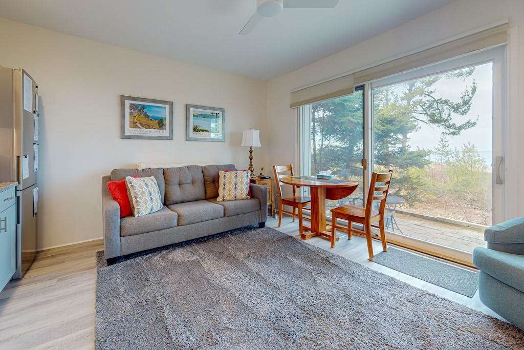 Desirable beachfront condo in Glen Arbor with patio, fireplace, kitchenette & AC