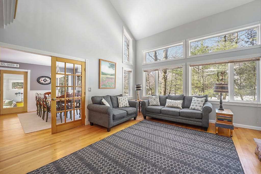 Spacious home with studio, lake access, sunroom, fireplace, washer & dryer, & central AC