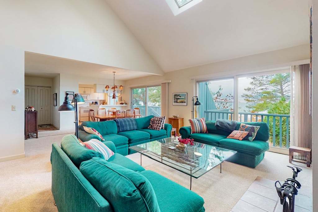 Beachfront condo with sunset & lake views, fireplace, washer & dryer