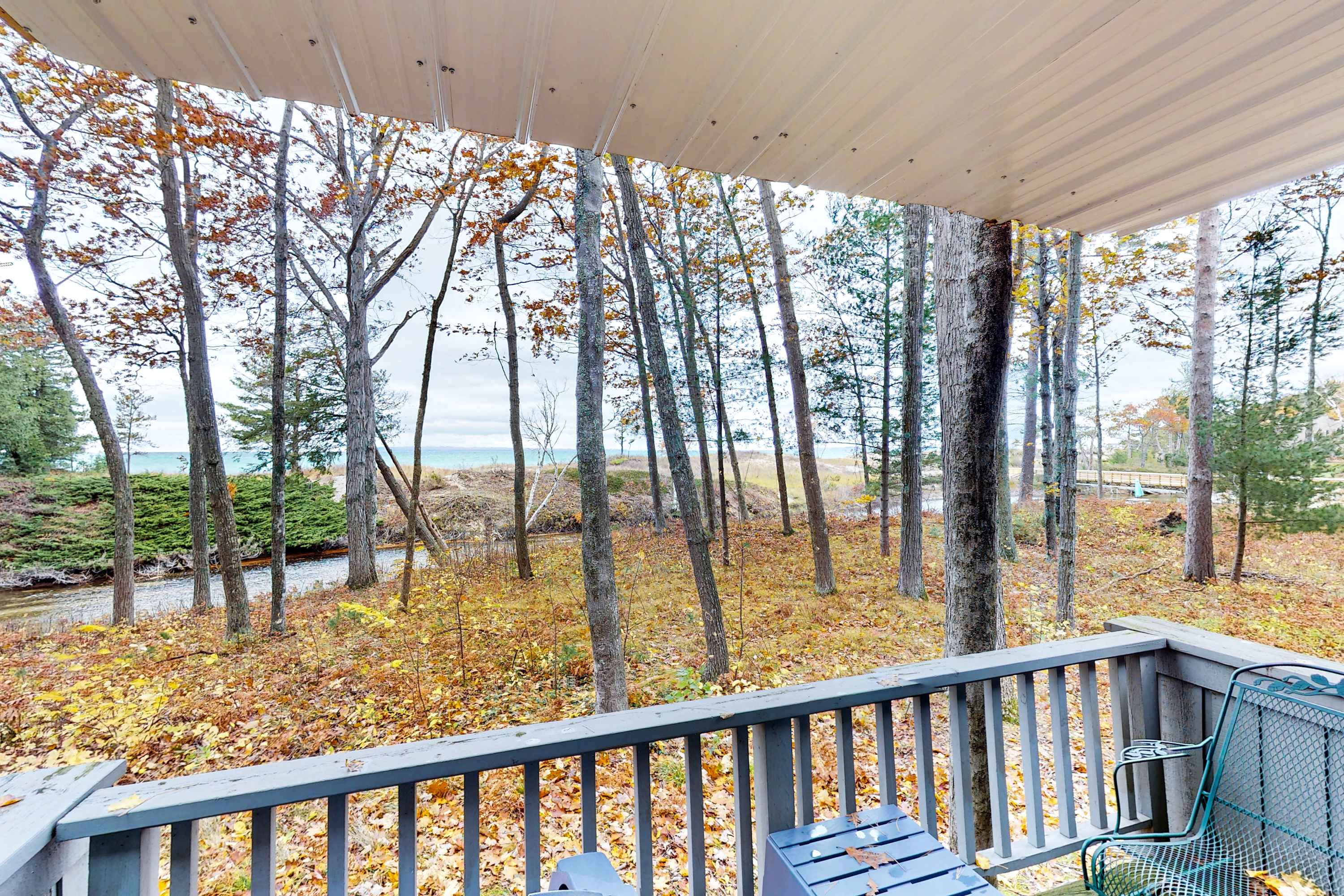 Riverfront condo with lake and river access, fireplace, firepit & gym