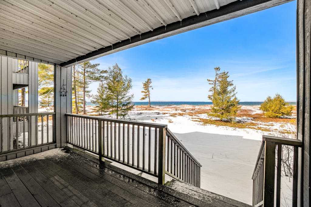 Lakefront condo with deck, gorgeous view, fireplace, & washer & dryer