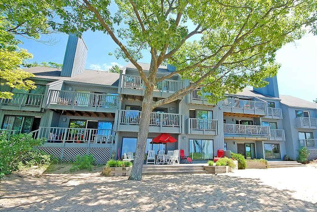 Beachfront condo with lake views, washer & dryer & fireplace