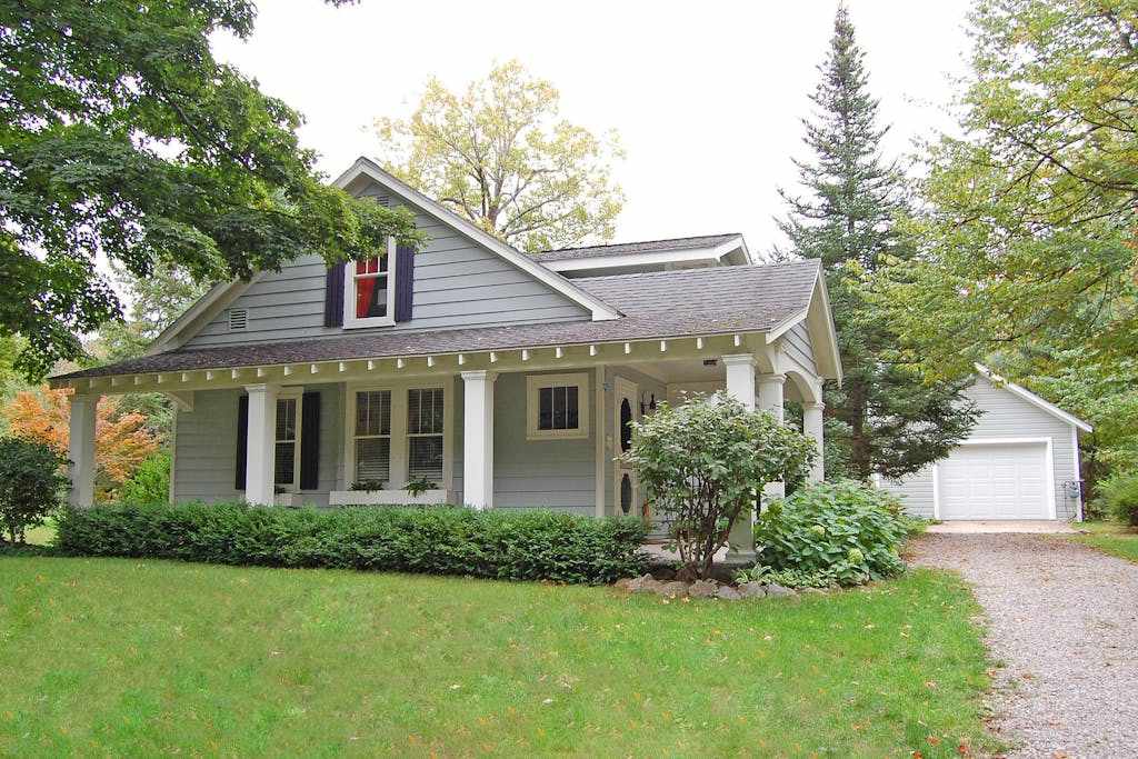 Charming home near Glen Arbor with a porch, gas grill, lake views, & AC