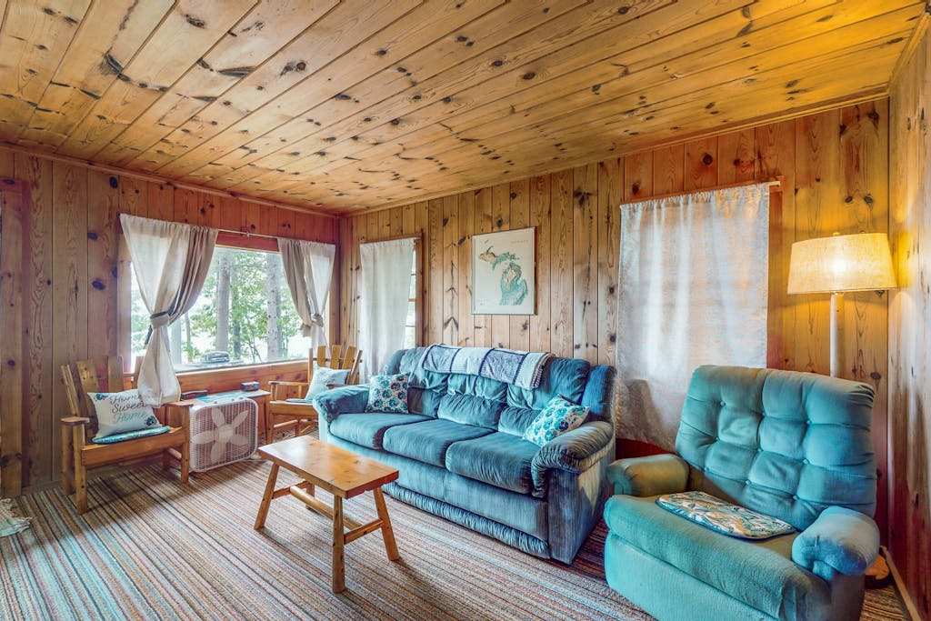 Charming lakefront cottage with large yard, dock, & fire pit - close to downtown