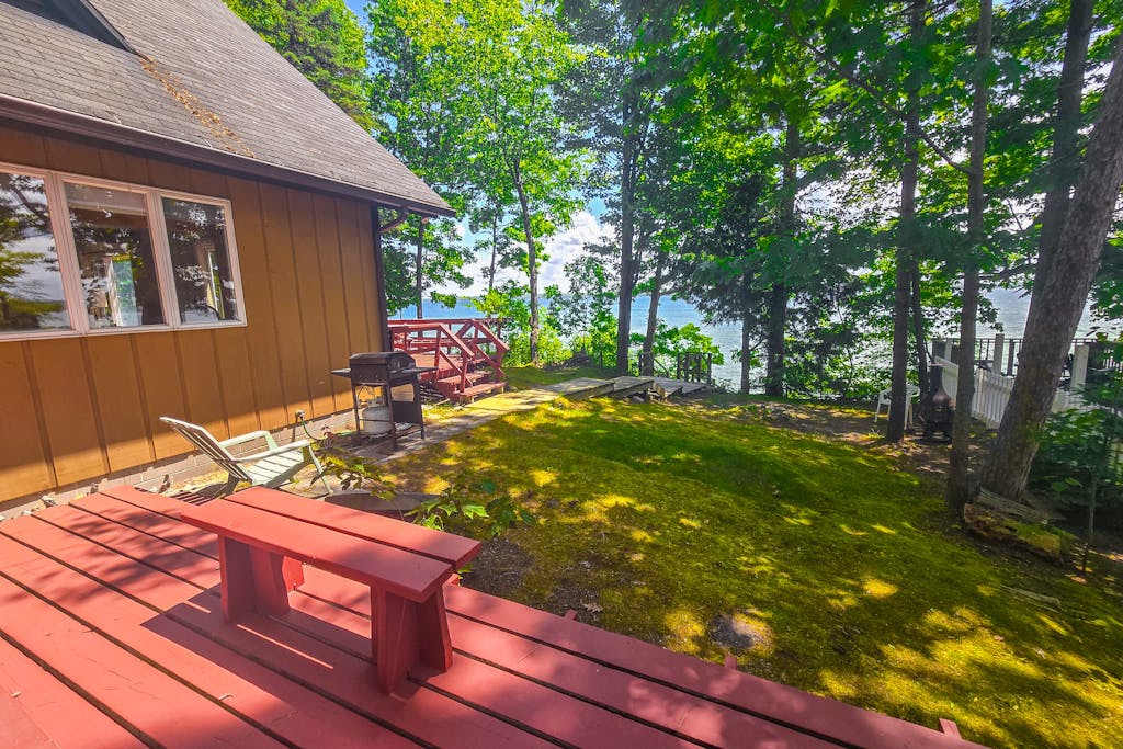 Incredible lakefront retreat with dock, fire pit, decks, yard, & amazing views