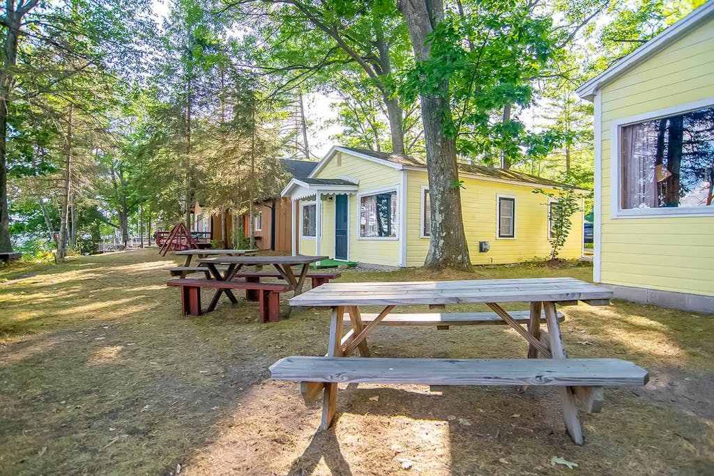 Charming lakefront cottage with large yard, dock, & fire pit - close to downtown