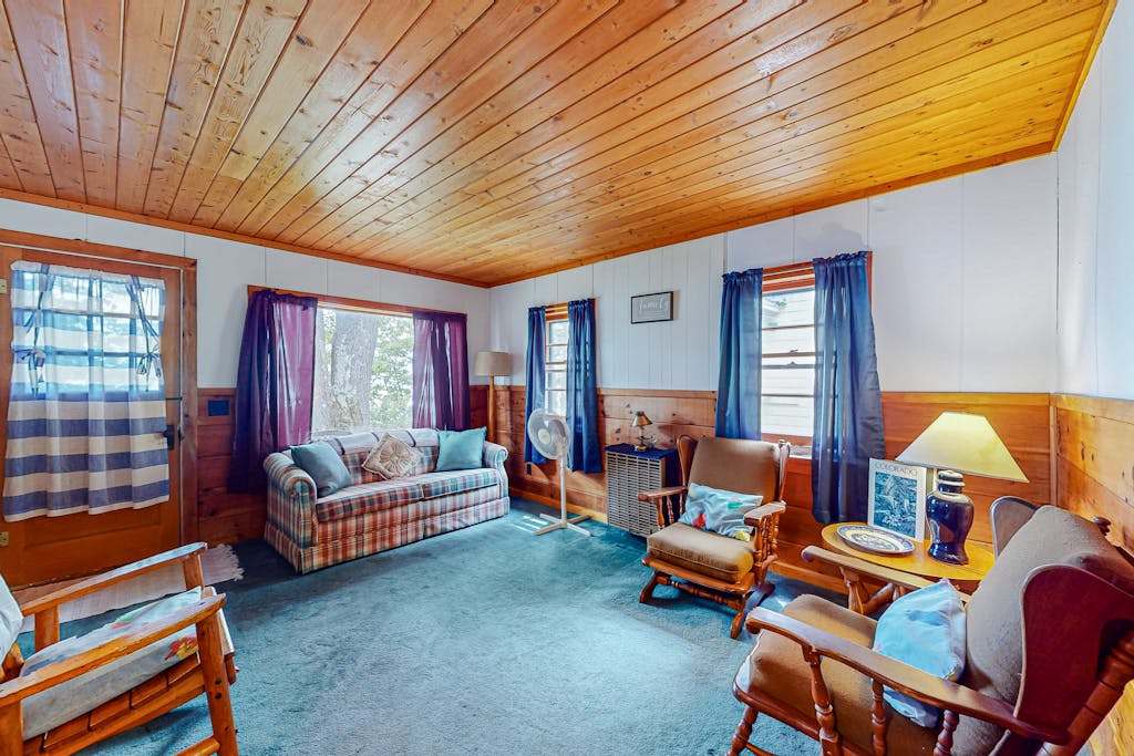 Charming lakefront cottage with large yard, dock, & fire pit - close to downtown